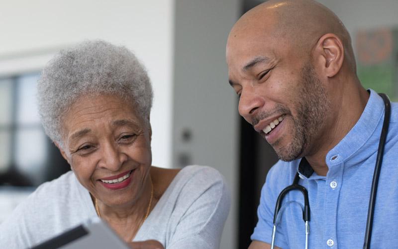 Image of Caregiver speaking with a patient