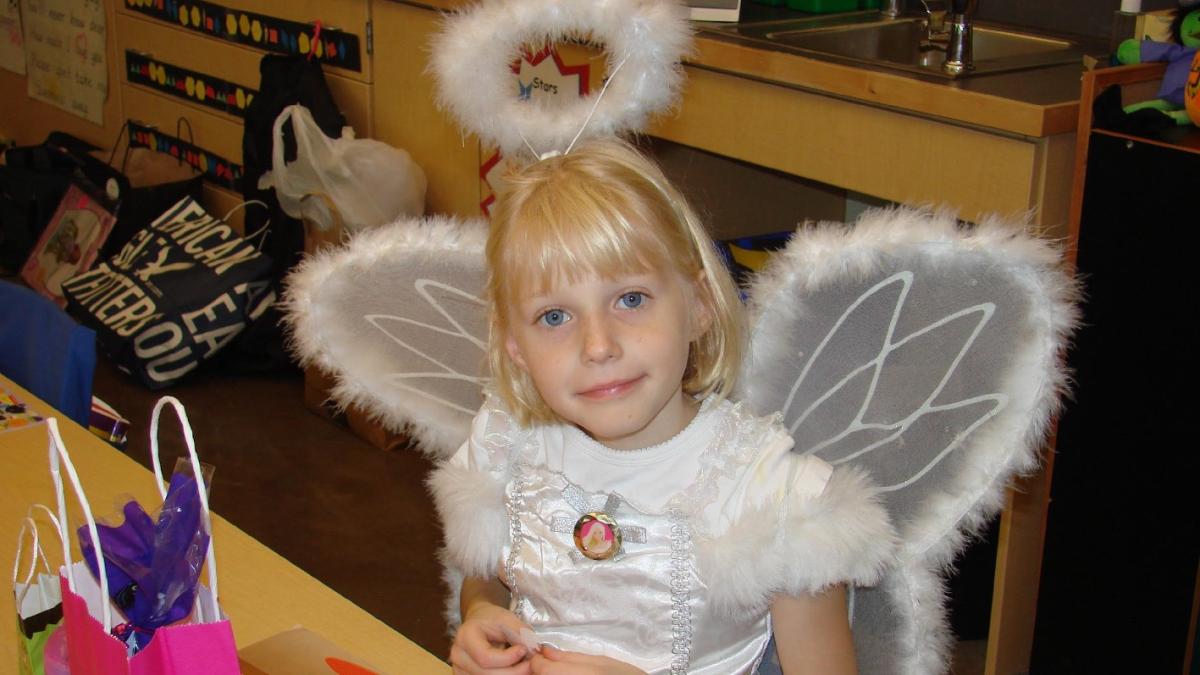 Maddy, dressed as an angel on Halloween before her diagnosis