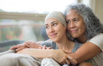 Caregiver hugging patient