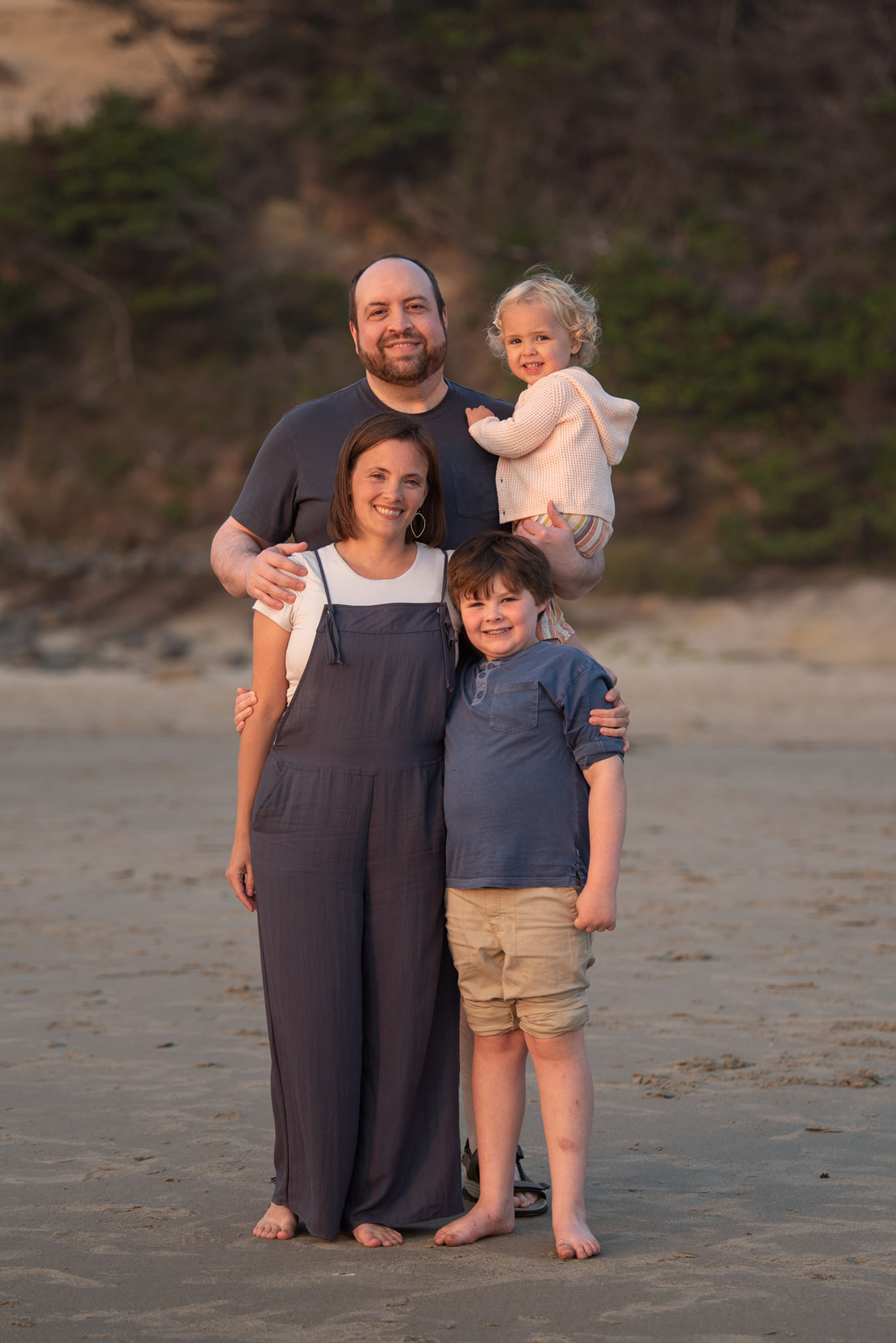 family impacted by blood cancer leukemia standing on the beach