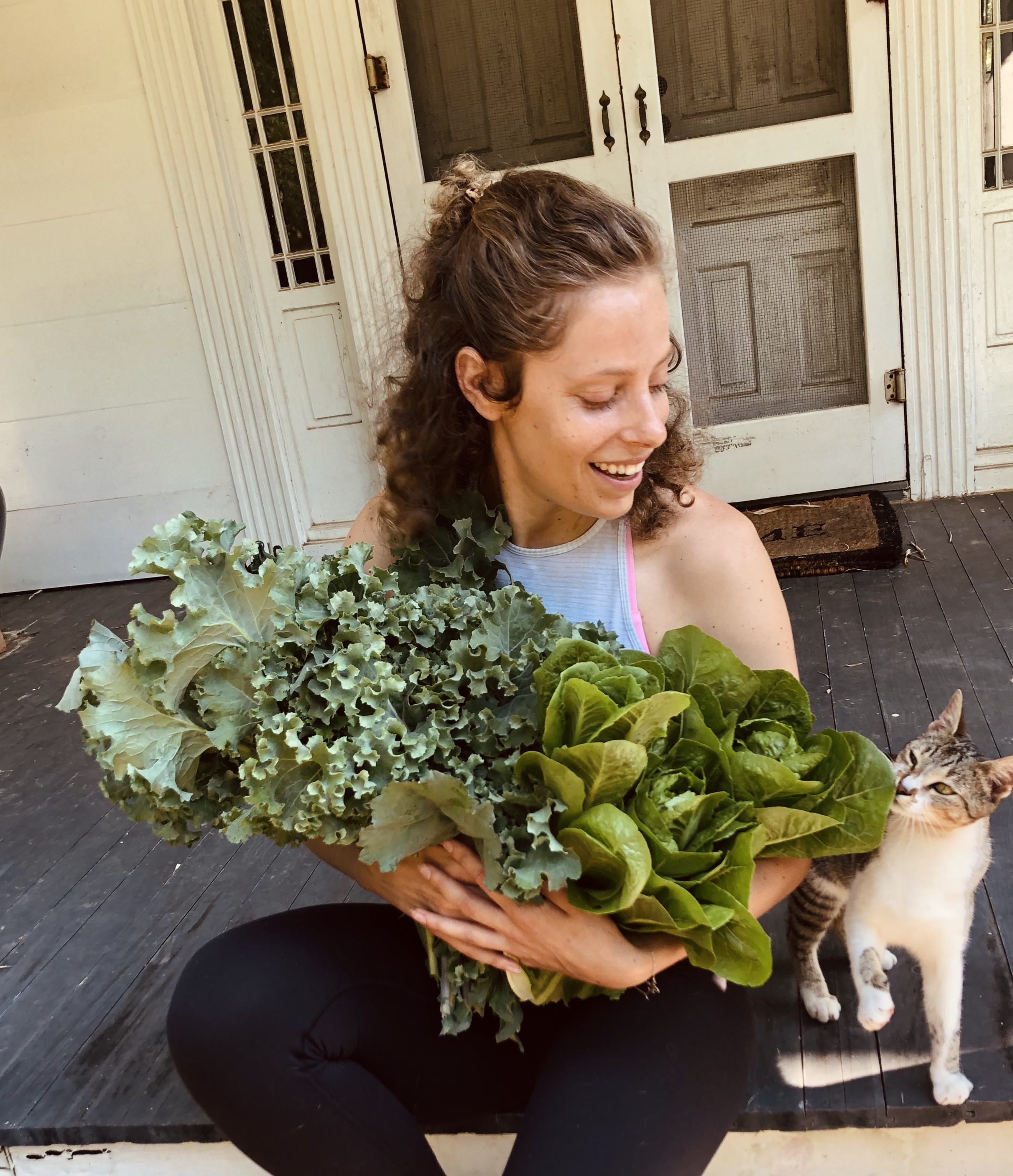 non-Hodgkin lymphoma survivor with green plant and cute cat