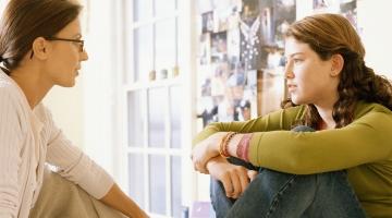 image of two women speaking