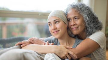 Caregiver hugging patient