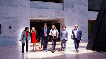 Volunteer advocates walking in Congressional building