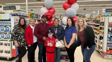 Walgreens gift certificate recipients in front of balloons in Bakersfield