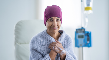 Female patient looking hopeful with IV bag