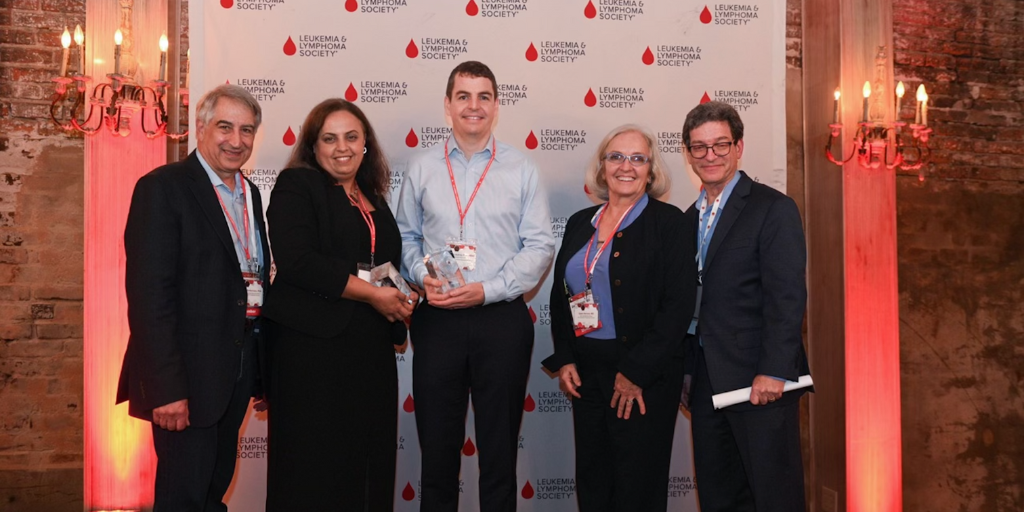 From left to right: Dr. Louis DeGennaro, LLS President & CEO; Dr. Noha Sharafeldin, CDP Achievement Award recipient; Dr. Brandon Aubrey, CDP Achievement Award recipient; Dr. Gwen Nichols, LLS Chief Medical Officer; Dr. Lee Greenberger, LLS Chief Scientifi