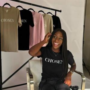 lymphoma chosen shirt in chair behind the scenes of photo shoot
