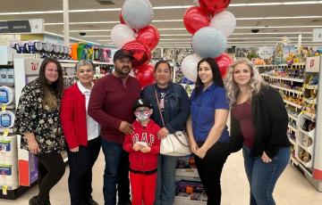 Walgreens gift certificate recipients in front of balloons in Bakersfield