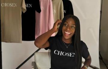 lymphoma chosen shirt in chair behind the scenes of photo shoot