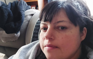 non-Hodgkin lymphoma (NHL) in living space with grey hoodie